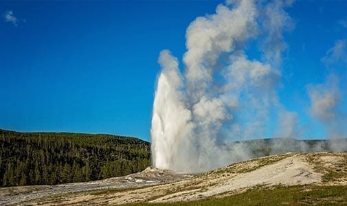 Old Faithful geyser erupting in Yellowstone National Park, Wyoming
