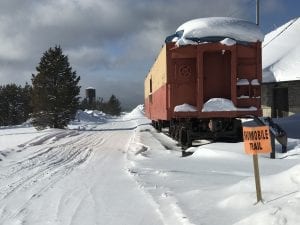 Snowmobile Trail Besides Rail Car